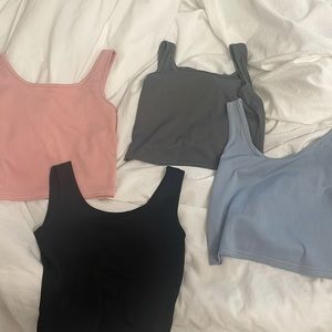 4 tank tops (pink, blue, grey, and black) never worn NWOT